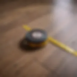 Measuring tape laid across a room floor to calculate square footage