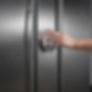 Demonstrating the proper technique to wipe a stainless steel fridge