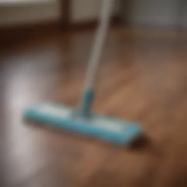 Close-up of a microfiber mop gliding over a wood floor