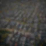 Aerial view of a bustling urban neighborhood showcasing residential properties.