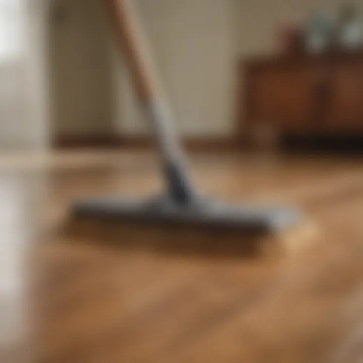 A professional demonstrating proper sweeping technique on hardwood