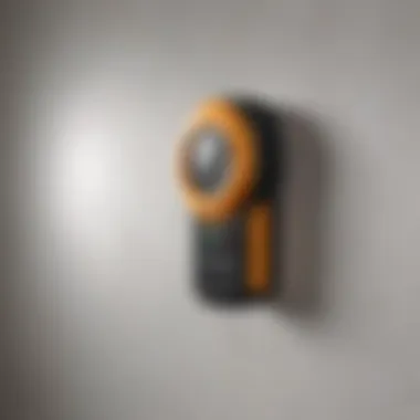 A close-up of a magnetic stud finder on a wall.