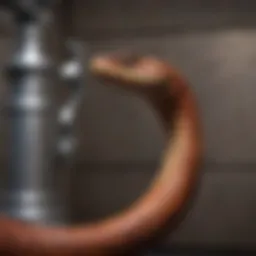 Close-up of a plumbing snake ready for use
